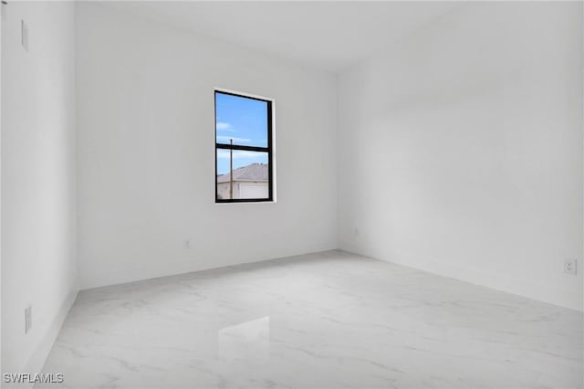 2003 Curry Ave N, Lehigh Acres, FL 33971 - unfurnished room featuring marble finish flooring