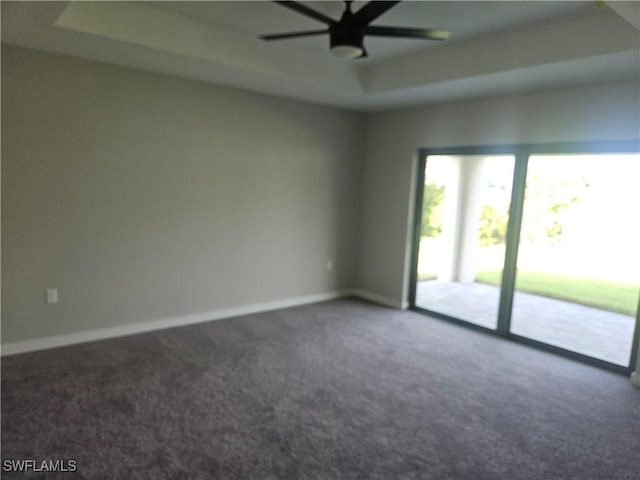 27584 Playa Del Rey Ln, Bonita Springs, FL 34135 - empty room featuring carpet, a ceiling fan, and a raised ceiling