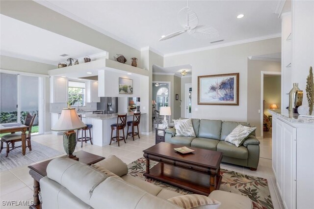3774 Whidbey Way, Naples, FL 34119 - living area with light tile patterned flooring and ornamental molding
