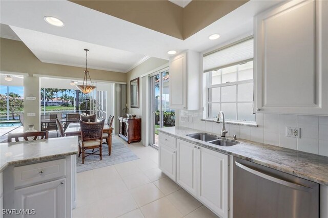 3774 Whidbey Way, Naples, FL 34119 - kitchen featuring a sink, dishwasher, white cabinets, backsplash, and crown molding