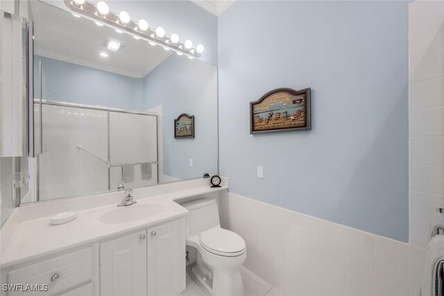 3774 Whidbey Way, Naples, FL 34119 - full bath featuring a stall shower, toilet, vanity, and crown molding