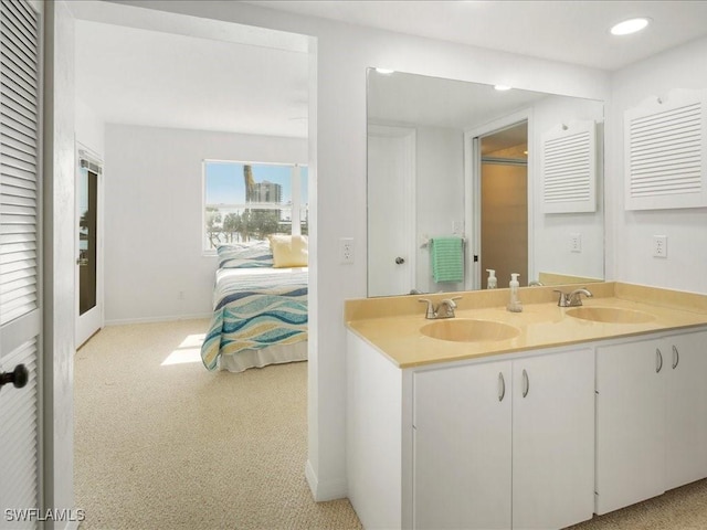 901 Collier Ct Unit 5-205, Marco Island, FL 34145 - full bathroom featuring ensuite bath, double vanity, baseboards, and recessed lighting
