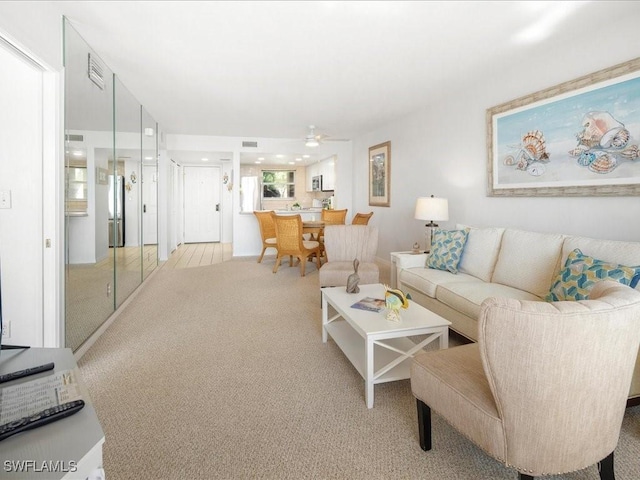 901 Collier Ct Unit 5-205, Marco Island, FL 34145 - living area with light colored carpet and ceiling fan