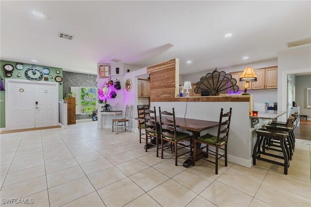 5208 Bygone St, Lehigh Acres, FL 33971 - dining room featuring light tile patterned floors, recessed lighting, and baseboards