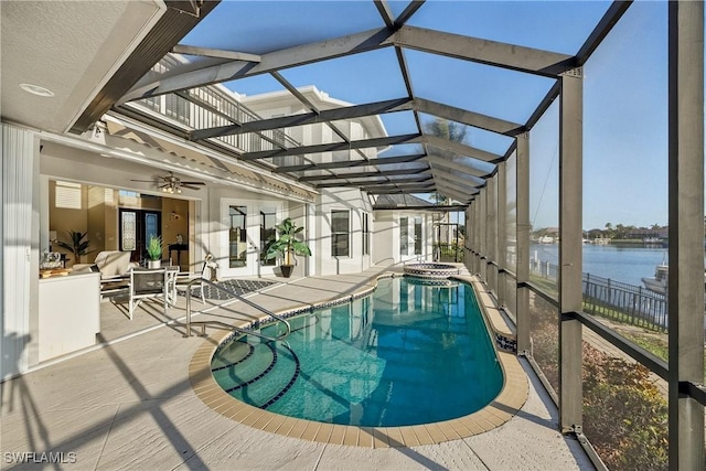 4013 Bastia Ct, Punta Gorda, FL 33950 - view of pool featuring french doors, a patio area, a water view, a pool with connected hot tub, and a ceiling fan