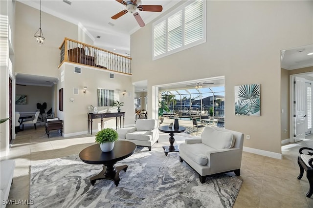 4013 Bastia Ct, Punta Gorda, FL 33950 - tiled living room with ceiling fan, crown molding, a high ceiling, and baseboards