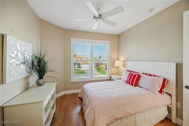 4013 Bastia Ct, Punta Gorda, FL 33950 - bedroom featuring baseboards, wood finished floors, and a ceiling fan