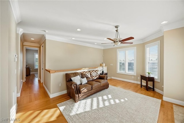 4013 Bastia Ct, Punta Gorda, FL 33950 - living area featuring light wood-style flooring, recessed lighting, ornamental molding, ceiling fan, and an upstairs landing