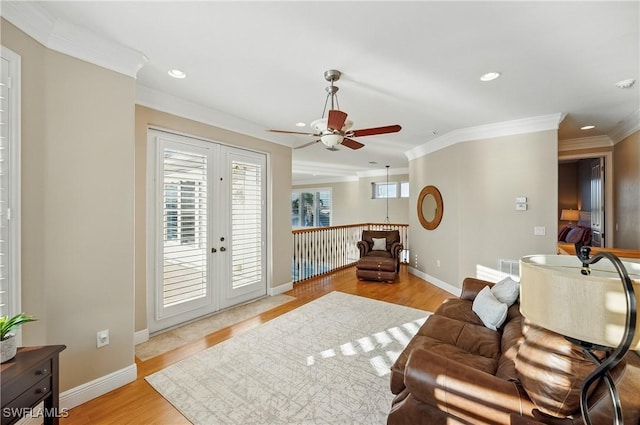 4013 Bastia Ct, Punta Gorda, FL 33950 - living area with ceiling fan, crown molding, recessed lighting, light wood-style flooring, and baseboards