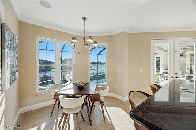 4013 Bastia Ct, Punta Gorda, FL 33950 - dining area featuring baseboards, a chandelier, light tile patterned floors, french doors, and crown molding