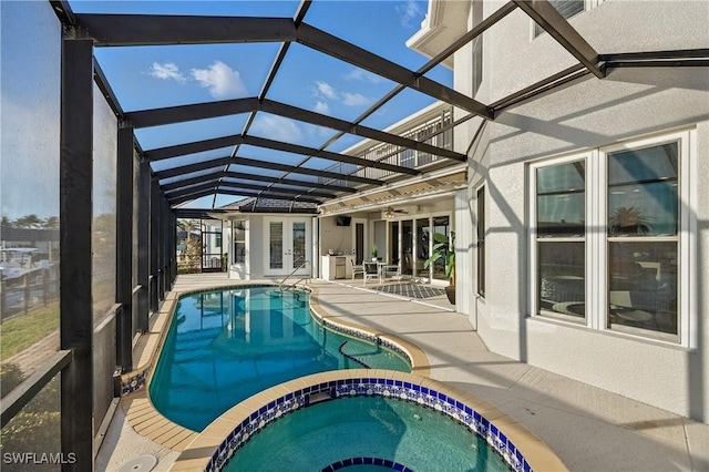 4013 Bastia Ct, Punta Gorda, FL 33950 - view of pool with french doors, a patio area, a pool with connected hot tub, ceiling fan, and glass enclosure
