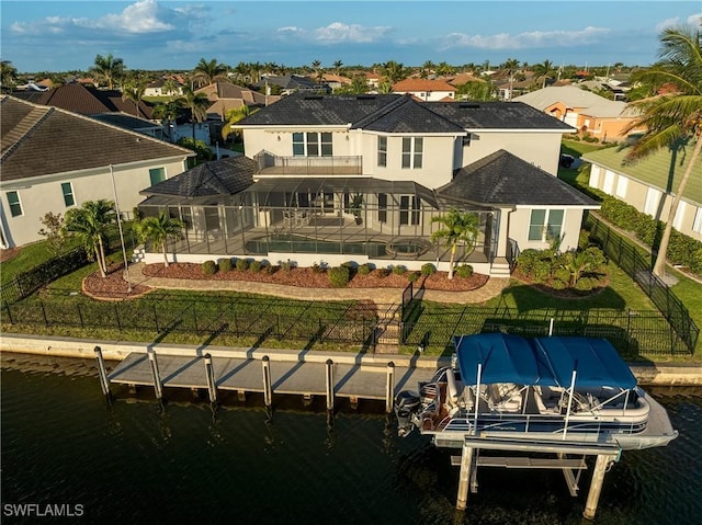 4013 Bastia Ct, Punta Gorda, FL 33950 - back of house with a balcony, boat lift, a residential view, and a patio area