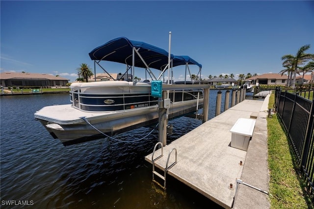 4013 Bastia Ct, Punta Gorda, FL 33950 - dock area featuring a water view, boat lift, and a residential view