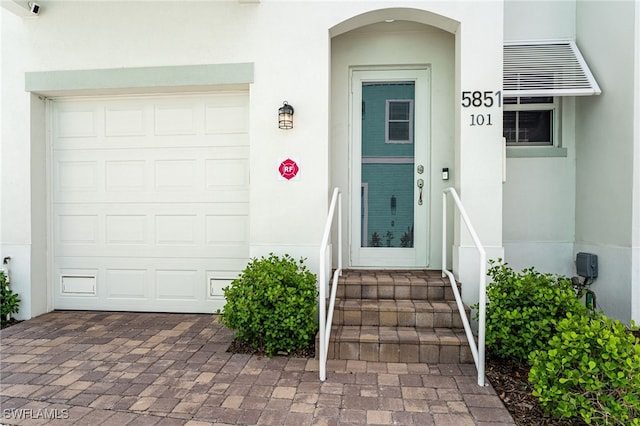 5851 Shell Cove Dr Unit 101A, Cape Coral, FL 33914 - view of exterior entry with stucco siding