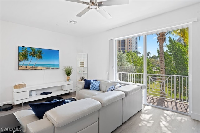 5851 Shell Cove Dr Unit 101A, Cape Coral, FL 33914 - living area with light wood-type flooring and a ceiling fan