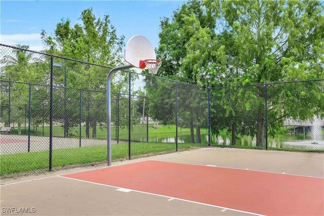 5851 Shell Cove Dr Unit 101A, Cape Coral, FL 33914 - view of basketball court with community basketball court and fence