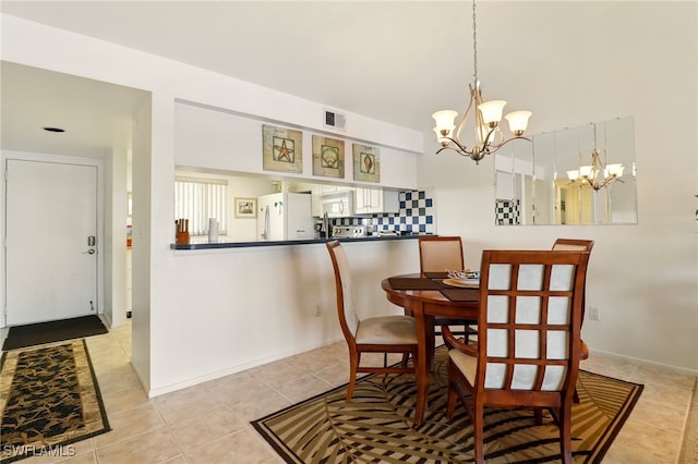 16000 Bay Pointe Blvd Unit 307, North Fort Myers, FL 33917 - dining room with a chandelier and light tile patterned floors