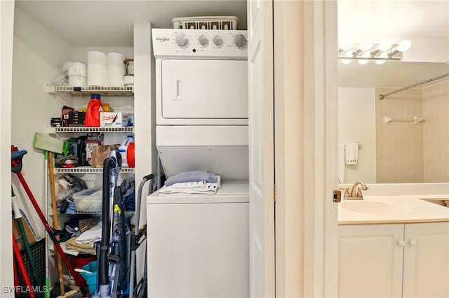 16000 Bay Pointe Blvd Unit 307, North Fort Myers, FL 33917 - laundry area featuring stacked washer and clothes dryer and a sink