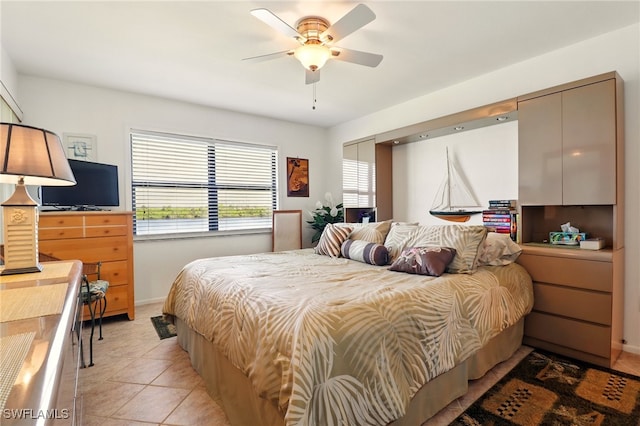 16000 Bay Pointe Blvd Unit 307, North Fort Myers, FL 33917 - bedroom with light tile patterned floors, baseboards, and ceiling fan