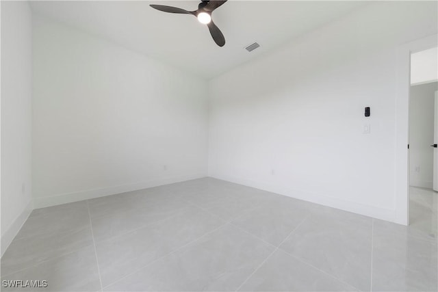619 Greenbriar Blvd, Lehigh Acres, FL 33972 - spare room with ceiling fan, light tile patterned floors, and baseboards