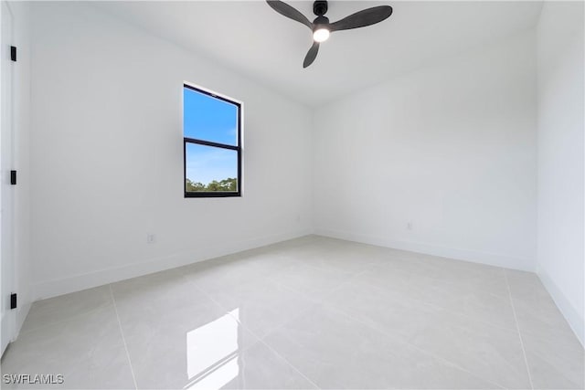 619 Greenbriar Blvd, Lehigh Acres, FL 33972 - unfurnished room featuring ceiling fan, light tile patterned floors, and baseboards