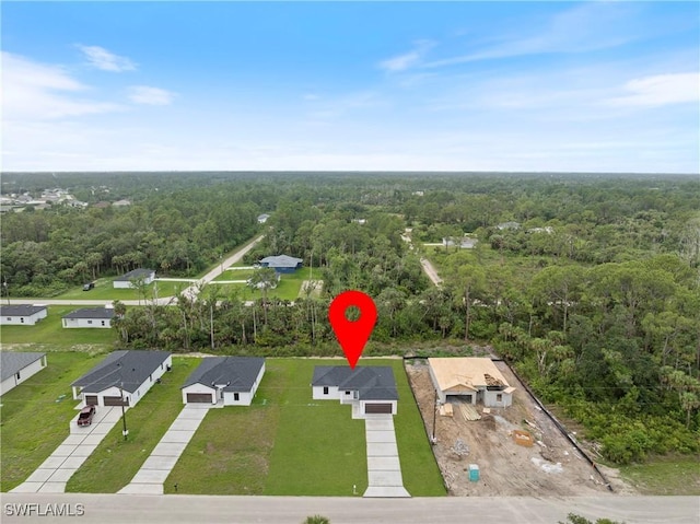 619 Greenbriar Blvd, Lehigh Acres, FL 33972 - aerial view of residential area with a forest