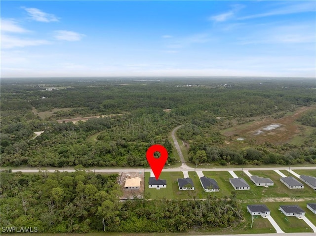 619 Greenbriar Blvd, Lehigh Acres, FL 33972 - aerial overview of property's location featuring a forest