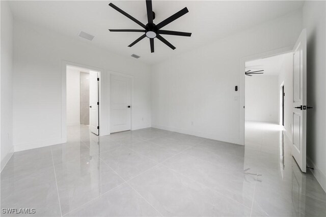 619 Greenbriar Blvd, Lehigh Acres, FL 33972 - unfurnished room featuring a ceiling fan, light tile patterned floors, and baseboards