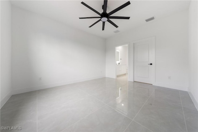 619 Greenbriar Blvd, Lehigh Acres, FL 33972 - spare room with a ceiling fan, tile patterned flooring, and baseboards