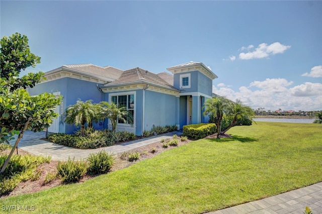 8881 Yucatan Ct, Naples, FL 34112 - view of side of home featuring a lawn and stucco siding