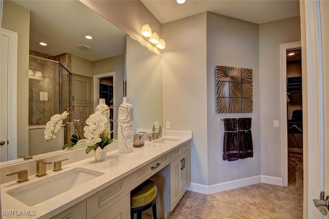8881 Yucatan Ct, Naples, FL 34112 - bathroom featuring a shower stall, a walk in closet, double vanity, recessed lighting, and tile patterned floors