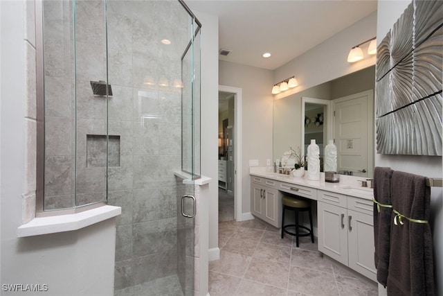 8881 Yucatan Ct, Naples, FL 34112 - bathroom featuring a shower stall, double vanity, tile patterned floors, and recessed lighting