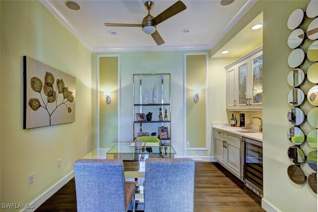8881 Yucatan Ct, Naples, FL 34112 - indoor bar with beverage cooler, a ceiling fan, crown molding, dark wood-style floors, and recessed lighting