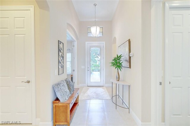 12490 Kentwood Ave, Fort Myers, FL 33913 - entryway featuring arched walkways, light tile patterned floors, and baseboards