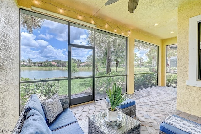 12490 Kentwood Ave, Fort Myers, FL 33913 - sunroom / solarium with a water view, brick floors, and a textured wall