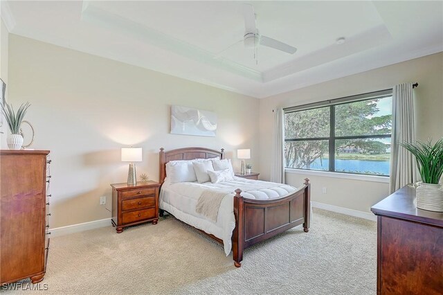 12490 Kentwood Ave, Fort Myers, FL 33913 - bedroom with a raised ceiling, light colored carpet, and baseboards