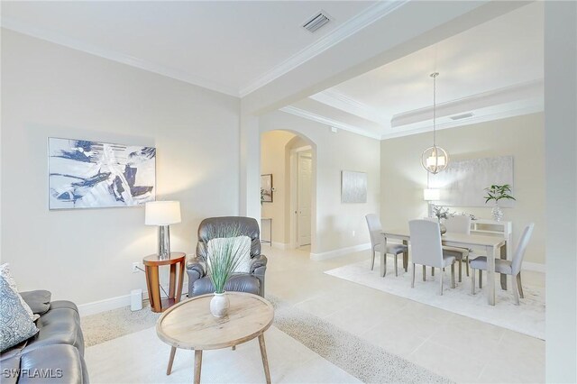 12490 Kentwood Ave, Fort Myers, FL 33913 - living room with arched walkways, ornamental molding, a tray ceiling, and baseboards