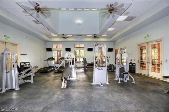 12490 Kentwood Ave, Fort Myers, FL 33913 - exercise room featuring french doors, ceiling fan, and a tray ceiling