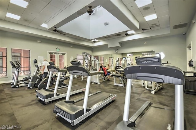 12490 Kentwood Ave, Fort Myers, FL 33913 - gym featuring a raised ceiling and ceiling fan