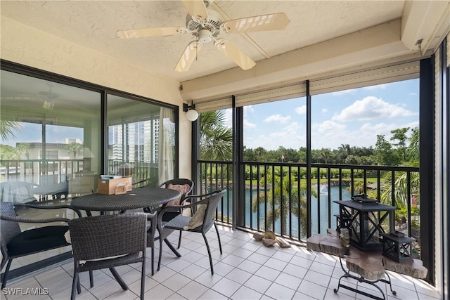 6979 Winkler Rd Unit 135, Fort Myers, FL 33919 - sunroom / solarium with a ceiling fan and a water view