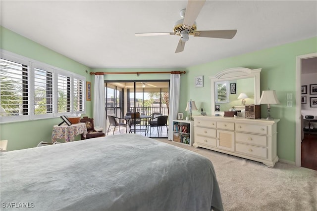6979 Winkler Rd Unit 135, Fort Myers, FL 33919 - bedroom with access to outside, light colored carpet, and ceiling fan