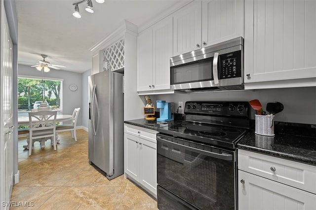 1210 Yesica Ann Cir Unit C105, Naples, FL 34110 - kitchen with stainless steel appliances, white cabinetry, a ceiling fan, and dark stone countertops