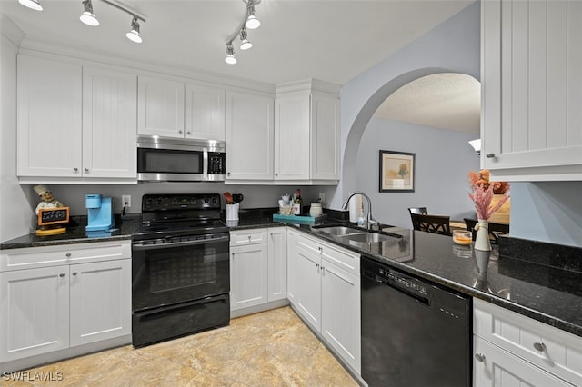 1210 Yesica Ann Cir Unit C105, Naples, FL 34110 - kitchen featuring black appliances, a sink, arched walkways, white cabinets, and dark stone countertops