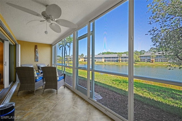 1210 Yesica Ann Cir Unit C105, Naples, FL 34110 - sunroom featuring a water view and ceiling fan