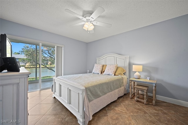 1210 Yesica Ann Cir Unit C105, Naples, FL 34110 - bedroom with access to outside, a textured ceiling, ceiling fan, baseboards, and tile patterned flooring
