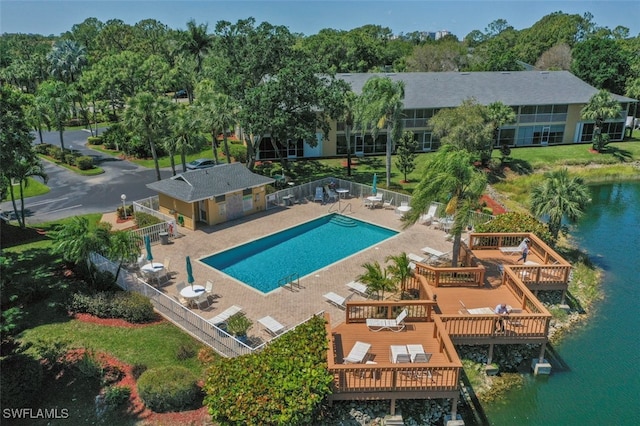 1210 Yesica Ann Cir Unit C105, Naples, FL 34110 - community pool featuring a deck with water view and fence