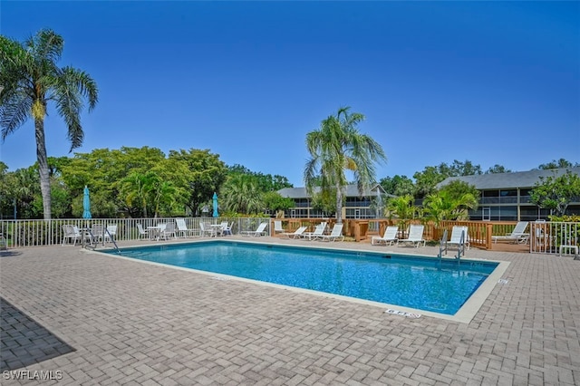 1210 Yesica Ann Cir Unit C105, Naples, FL 34110 - community pool with fence and a patio area