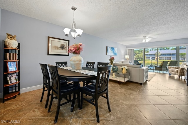1210 Yesica Ann Cir Unit C105, Naples, FL 34110 - tiled dining room featuring a chandelier, a textured ceiling, and a ceiling fan