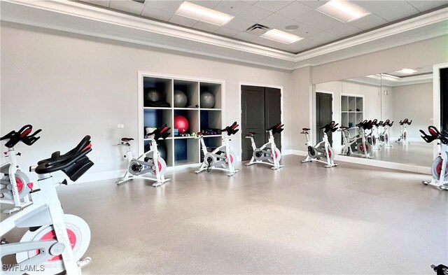 8736 Naples Heritage Dr, Naples, FL 34112 - exercise room featuring a tray ceiling, baseboards, ornamental molding, and a paneled ceiling
