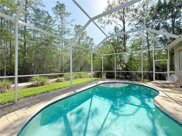 8736 Naples Heritage Dr, Naples, FL 34112 - outdoor pool with glass enclosure and a patio